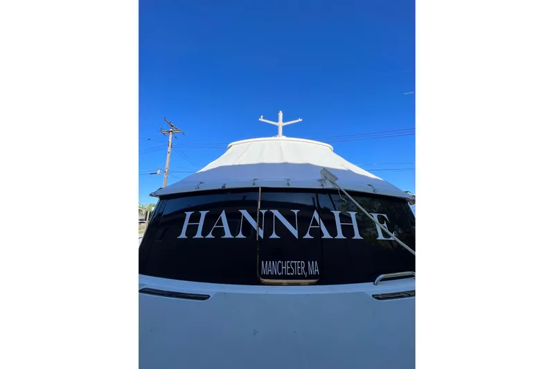 Hannah E Yacht Photos Pics 2015 Back Cove 30 boat named "HANNAH E" in Manchester, MA, under clear blue sky.