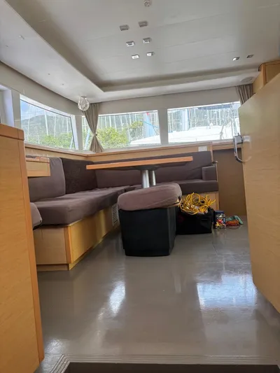 King Lewis Yacht Photos Pics Interior of a 2016 Lagoon 450 catamaran with seating and table.