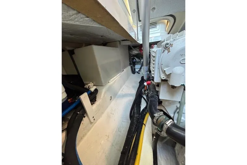 Hannah E Yacht Photos Pics Engine compartment of a 2018 Back Cove 30 boat, showcasing mechanical components and wiring.