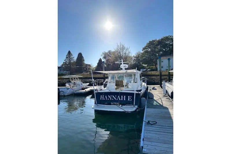 Hannah E Yacht Photos Pics 2018 Back Cove 30 boat docked under clear sky, named "HANNAH E".