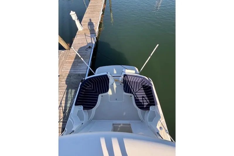 Hannah E Yacht Photos Pics 2018 Back Cove 30 boat docked, aerial view of deck and seating area.