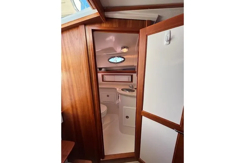 Hannah E Yacht Photos Pics 2018 Back Cove 30 yacht interior bathroom with wooden finish and compact design.