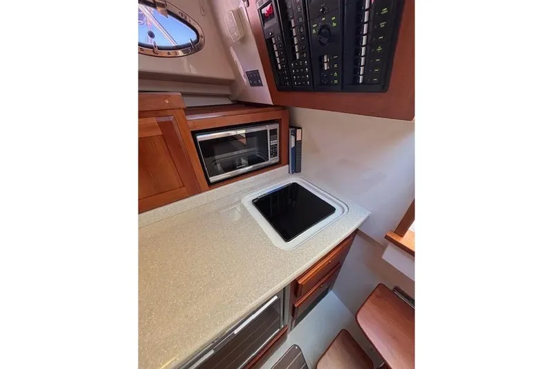 Hannah E Yacht Photos Pics 2018 Back Cove 30 yacht interior galley with microwave and control panel.