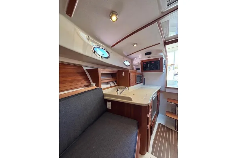 Hannah E Yacht Photos Pics Interior of 2018 Back Cove 30 boat with modern kitchen and seating area.