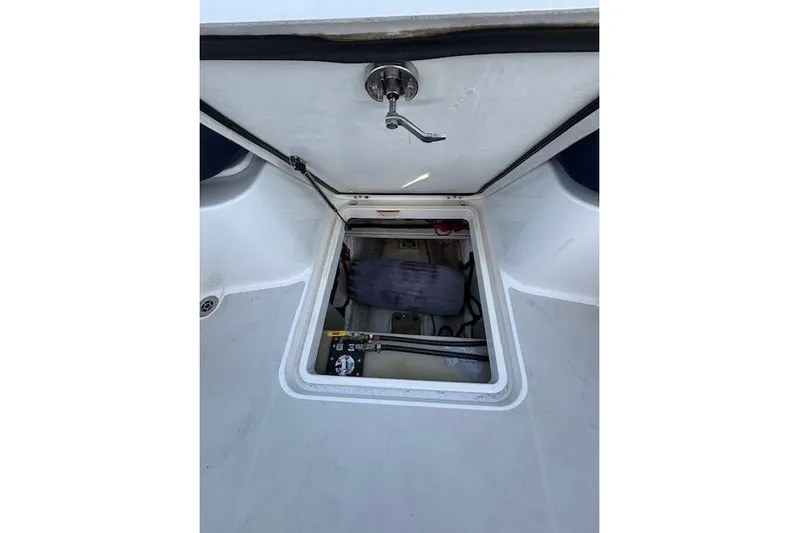 Hannah E Yacht Photos Pics Open hatch on 2018 Back Cove 30 boat, revealing storage compartment.