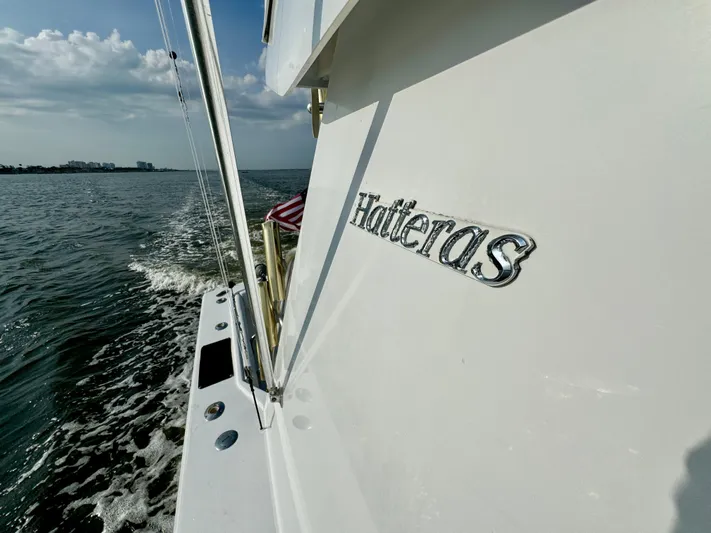 Reel Amnesia Yacht Photos Pics 1984 Hatteras 36 Convertible yacht cruising on open water.