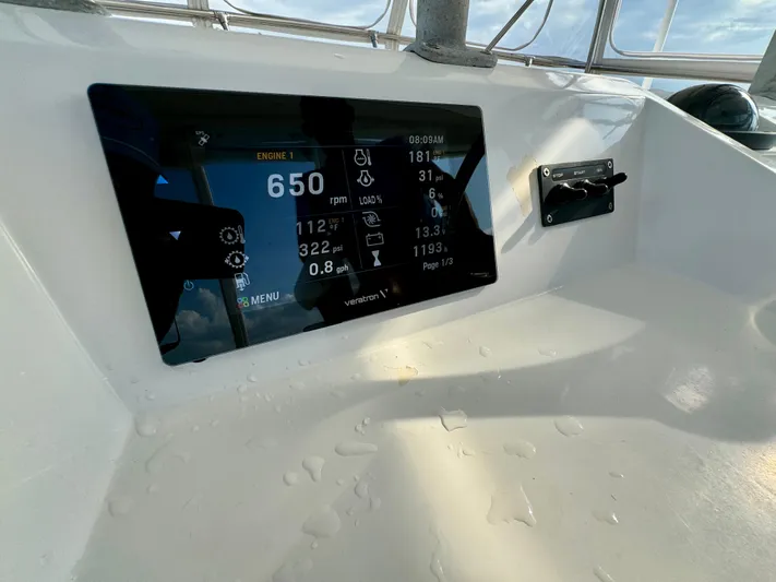 Reel Amnesia Yacht Photos Pics Digital dashboard of a 1984 Hatteras 36 Convertible boat displaying engine metrics.