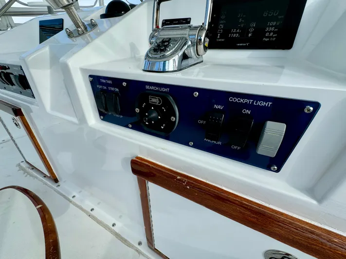 Reel Amnesia Yacht Photos Pics Control panel of a 1984 Hatteras 36 Convertible boat with switches and gauges.