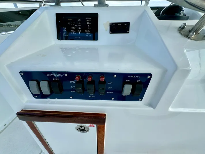 Reel Amnesia Yacht Photos Pics Control panel of a 1984 Hatteras 36 Convertible boat with switches and display.