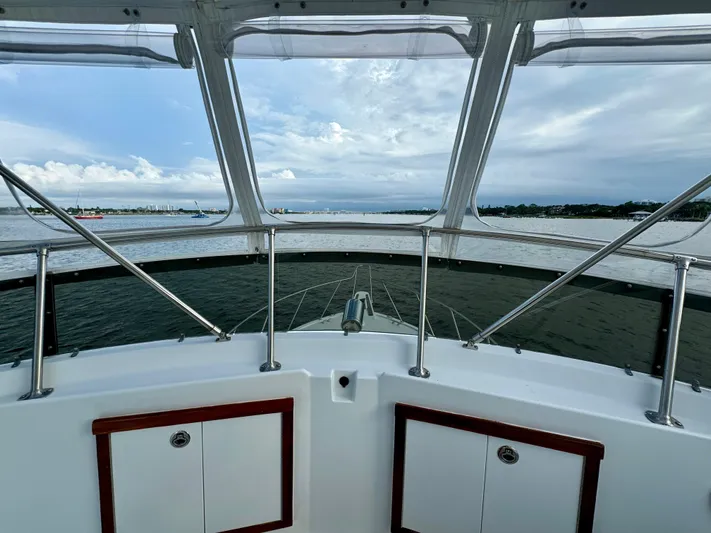 Reel Amnesia Yacht Photos Pics 1984 Hatteras 36 Convertible yacht interior with ocean view through windows.