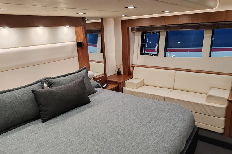  Yacht Photos Pics Luxurious interior of 2010 Sunseeker Predator 64 yacht with elegant bedroom and seating area.