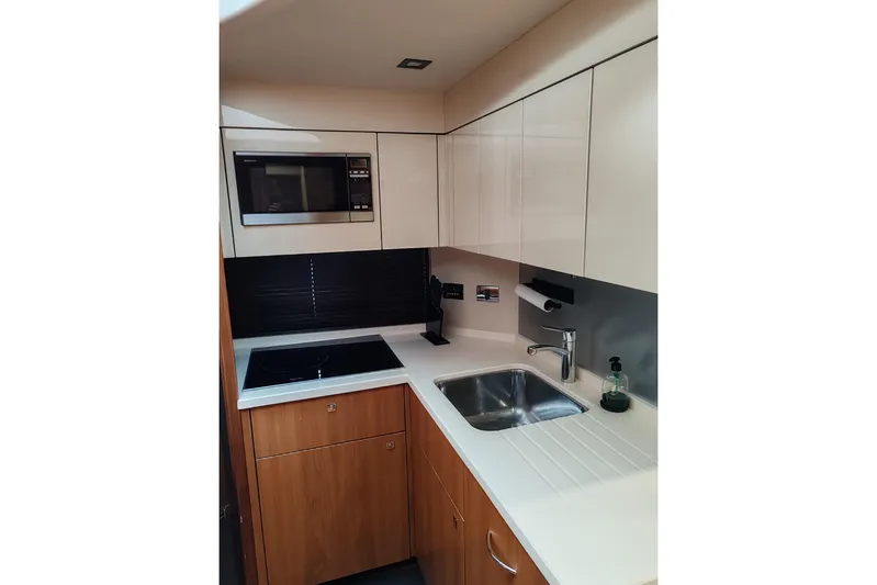  Yacht Photos Pics Modern kitchen in 2010 Sunseeker Predator 64 yacht with microwave and sink.