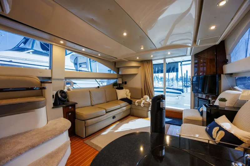 Why Knot Yacht Photos Pics Luxurious interior of 2010 Meridian 391 Sedan yacht with modern furnishings.