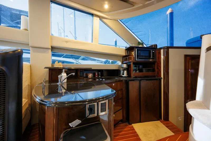 Why Knot Yacht Photos Pics Interior of 2010 Meridian 391 Sedan yacht with modern kitchen amenities.