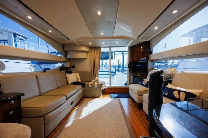 Why Knot Yacht Photos Pics Luxurious interior of 2010 Meridian 391 Sedan yacht with elegant seating and modern decor.