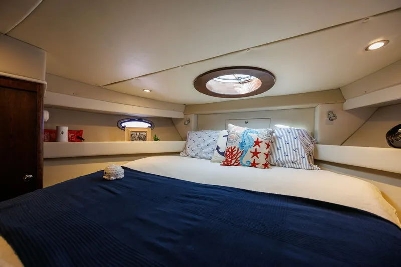 Why Knot Yacht Photos Pics Luxurious cabin interior of 2010 Meridian 391 Sedan yacht with nautical-themed decor.