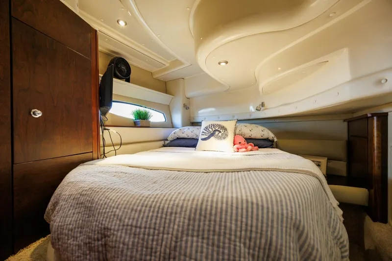 Why Knot Yacht Photos Pics Luxurious cabin interior of 2010 Meridian 391 Sedan yacht with cozy bed and decor.