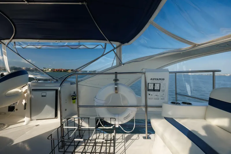 Why Knot Yacht Photos Pics 2010 Meridian 391 Sedan yacht interior with ocean view, featuring seating and safety equipment.