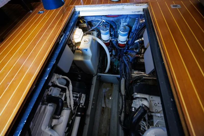 Why Knot Yacht Photos Pics Engine compartment of a 2010 Meridian 391 Sedan yacht with visible components and wiring.