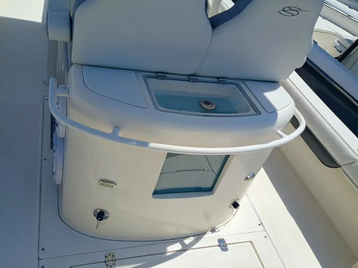 270-912 Yacht Photos Pics 2024 ShearWater 270 Carolina SS Open Bow boat interior with seating and storage features.