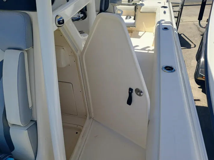 270-912 Yacht Photos Pics 2024 ShearWater 270 Carolina SS Open Bow interior view, featuring seating and storage compartments.