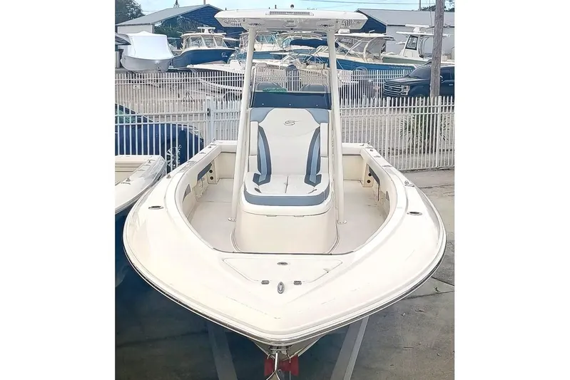 270-912 Yacht Photos Pics 2024 ShearWater 270 Carolina SS Open Bow boat, sleek design, parked in marina.