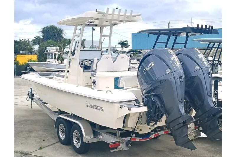 270-912 Yacht Photos Pics 2024 ShearWater 270 Carolina SS Open Bow boat with dual Yamaha engines on trailer.