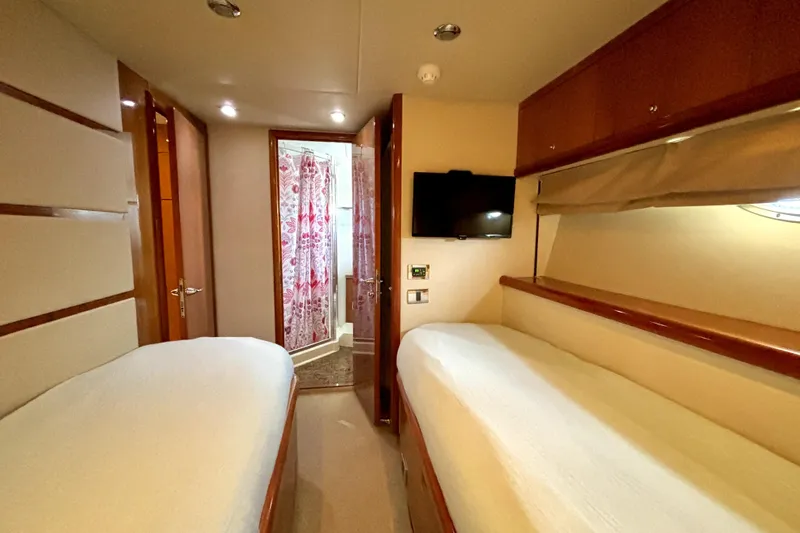  Yacht Photos Pics Interior cabin of 2005 Sunseeker 75 Sport Yacht with twin beds and TV.