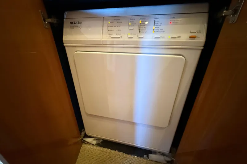  Yacht Photos Pics Miele dryer inside a 2005 Sunseeker 75 Sport Yacht, with control panel visible.