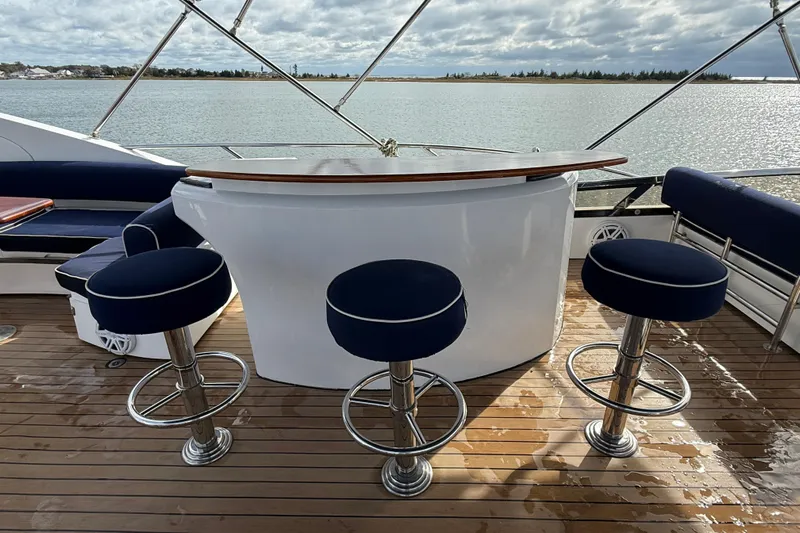  Yacht Photos Pics Luxury yacht deck with bar stools on Sunseeker 75 Sport Yacht, 2005 model.