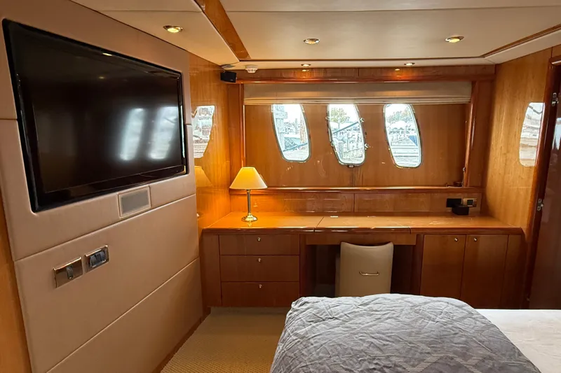  Yacht Photos Pics Luxurious cabin interior of a 2005 Sunseeker 75 Sport Yacht with TV and desk.