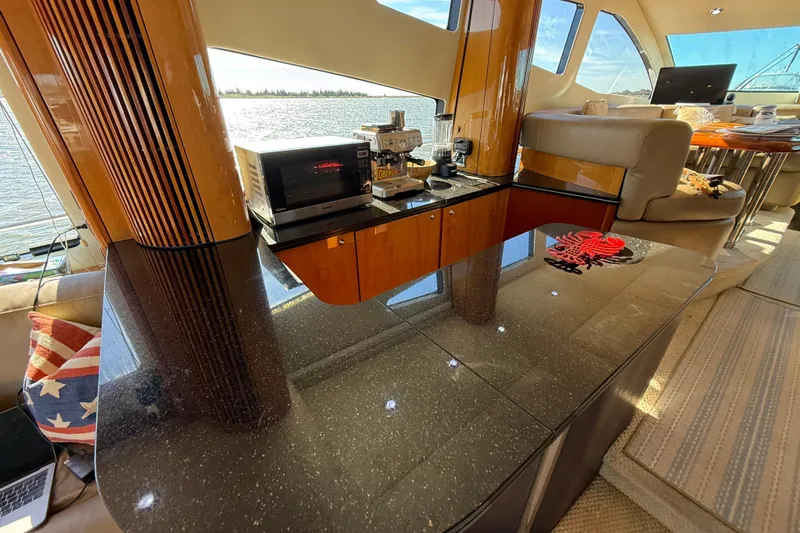  Yacht Photos Pics Luxurious interior of 2005 Sunseeker 75 Sport Yacht with modern kitchen amenities.
