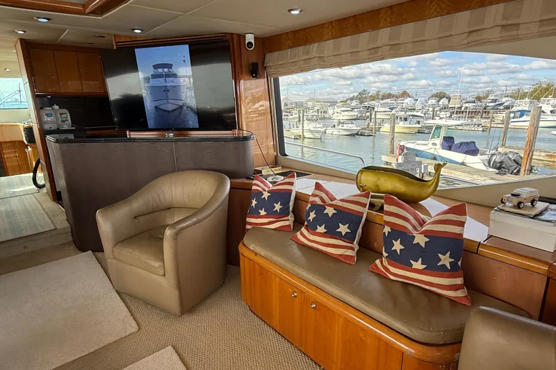  Yacht Photos Pics Luxurious 2005 Sunseeker 75 Sport Yacht interior with marina view and patriotic decor.