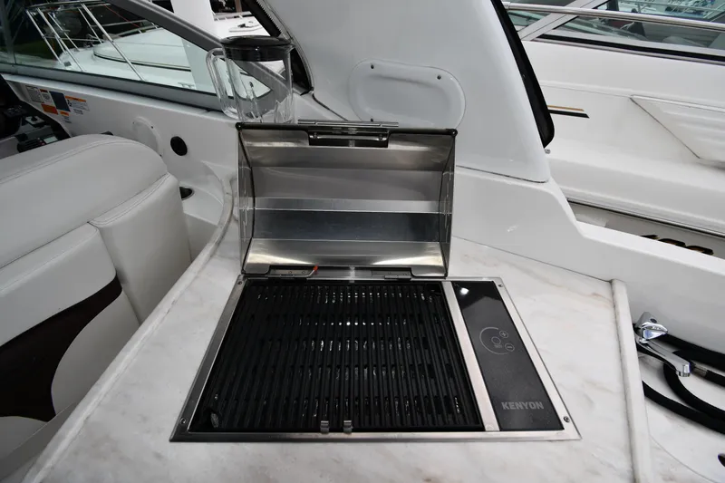  Yacht Photos Pics 2014 Rinker 310 Express Cruiser with Kenyon grill on deck.