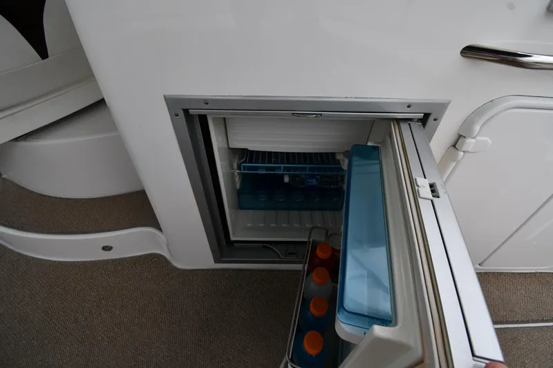  Yacht Photos Pics Mini fridge on 2014 Rinker 310 Express Cruiser, stocked with beverages.
