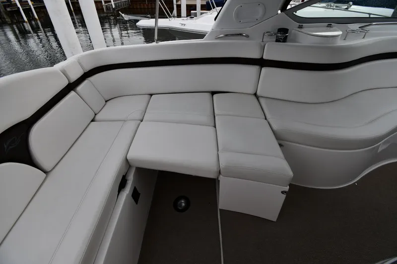  Yacht Photos Pics 2014 Rinker 310 Express Cruiser interior with white leather seating and sleek design.