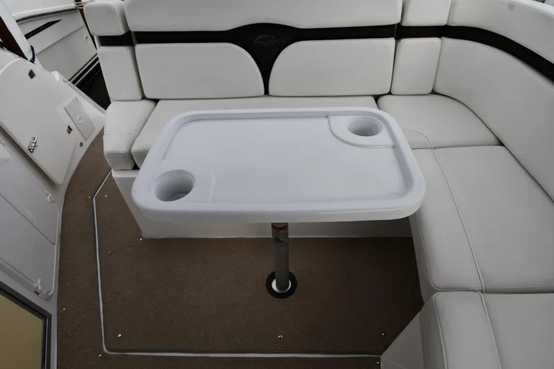  Yacht Photos Pics 2014 Rinker 310 Express Cruiser interior with white seating and table.