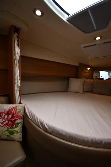  Yacht Photos Pics 2014 Rinker 310 Express Cruiser cabin with cozy bed and ambient lighting.