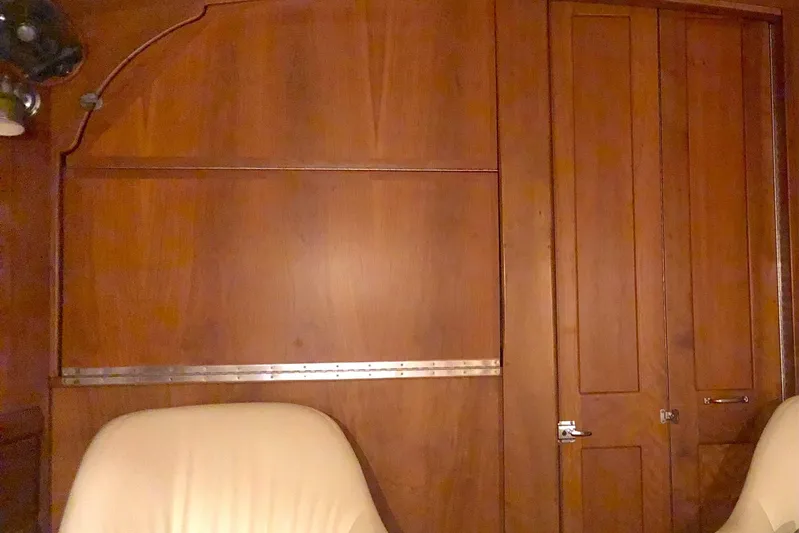  Yacht Photos Pics Interior of 1997 Gozzard 44 yacht with wooden paneling and beige seating.