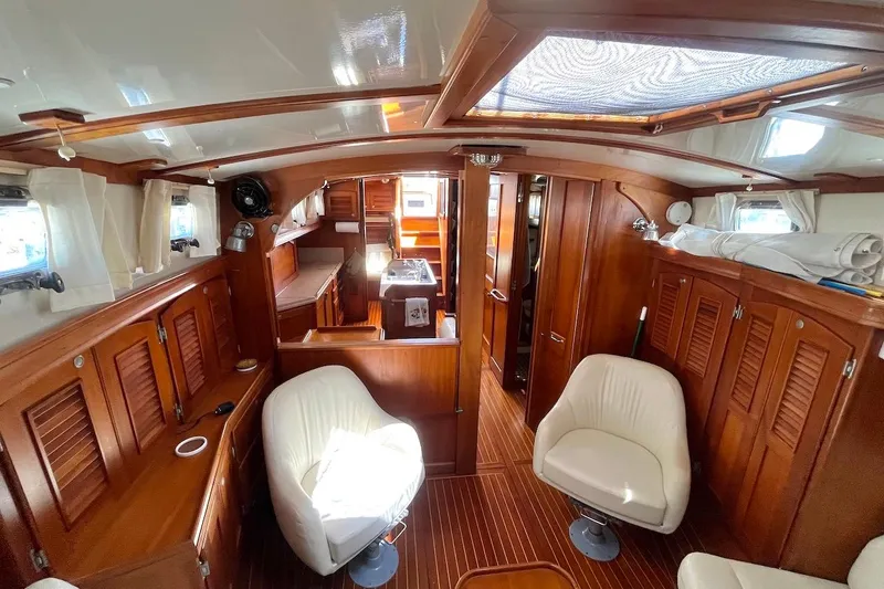  Yacht Photos Pics Luxurious 1997 Gozzard 44 yacht interior with elegant wood finish and comfortable seating.