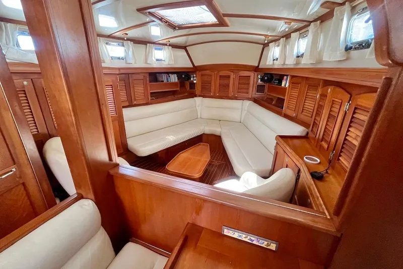  Yacht Photos Pics Luxurious 1997 Gozzard 44 yacht interior with elegant wood finish and plush seating.