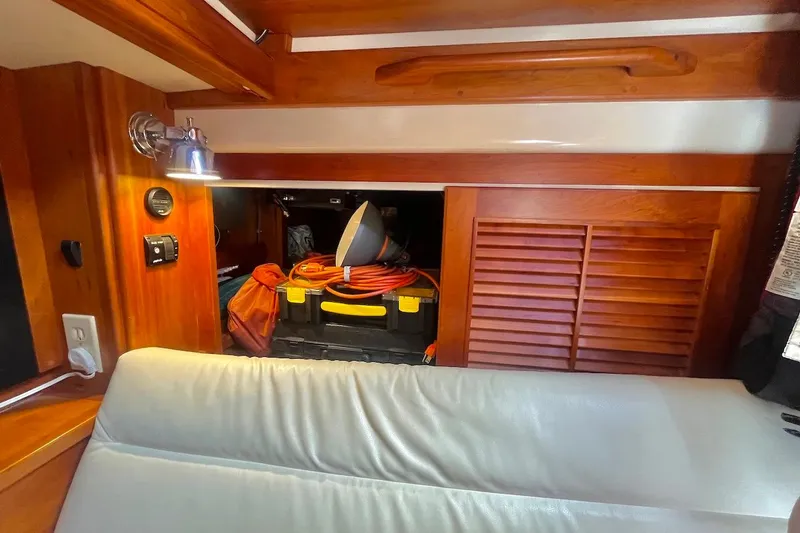  Yacht Photos Pics Interior of 1997 Gozzard 44 yacht with wooden cabinetry and storage area.