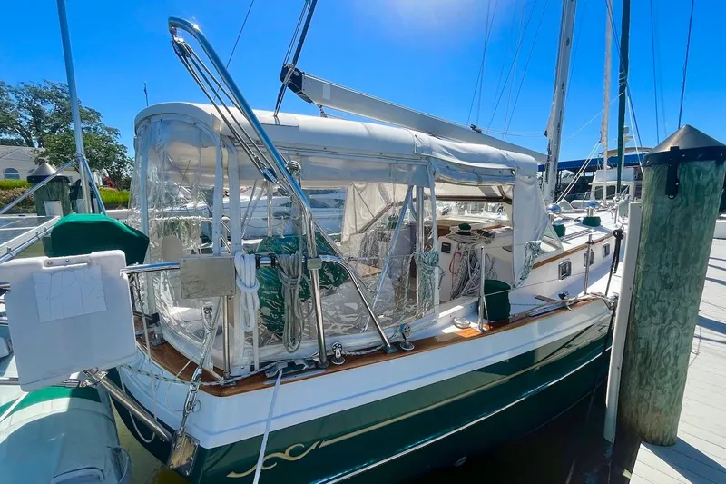  Yacht Photos Pics Sailboat Gozzard 44, 1997 model, docked with clear canopy and polished wood accents.