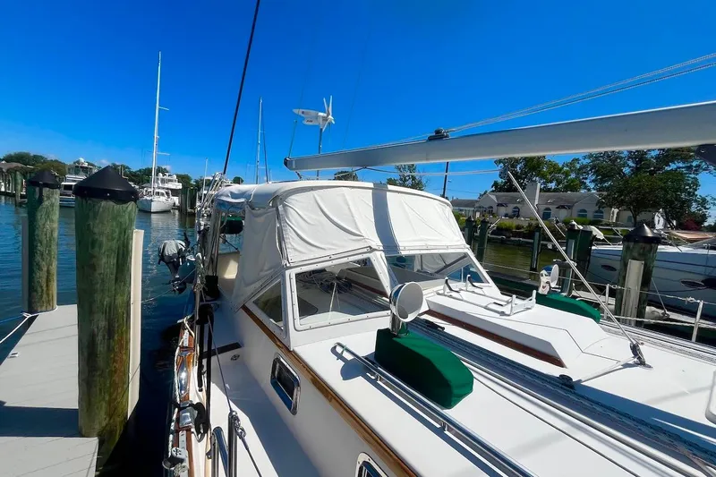  Yacht Photos Pics Sailboat docked at marina, Gozzard 44 model, 1997, under clear blue sky.