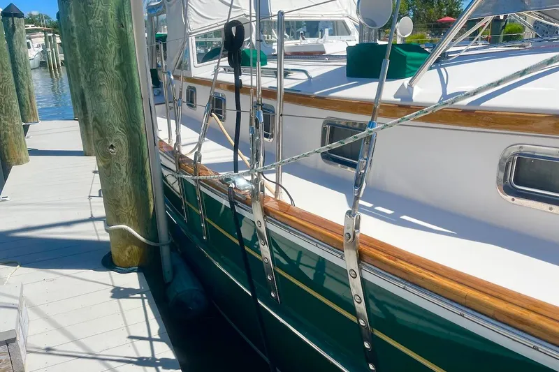  Yacht Photos Pics 1997 Gozzard 44 yacht docked, showcasing elegant design and polished wood accents.