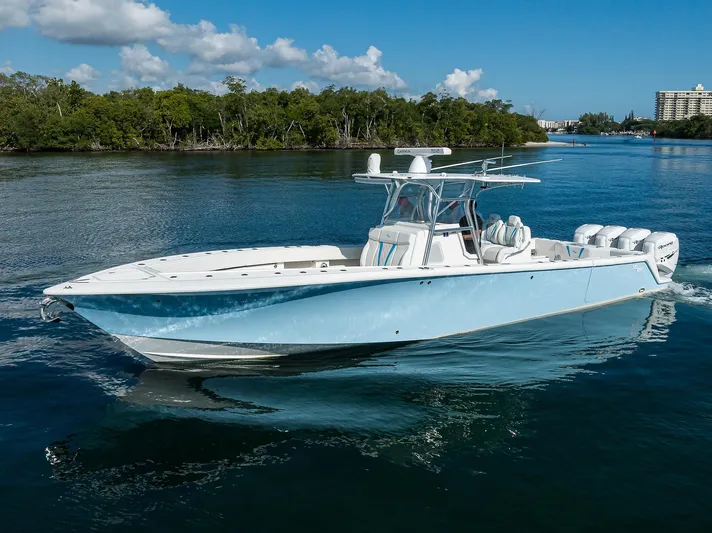  Yacht Photos Pics 2008 SeaVee 39b boat cruising on a calm waterway under a clear blue sky.