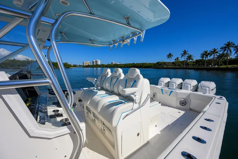  Yacht Photos Pics 2008 SeaVee 39b boat interior with white seating, blue accents, and scenic waterfront view.