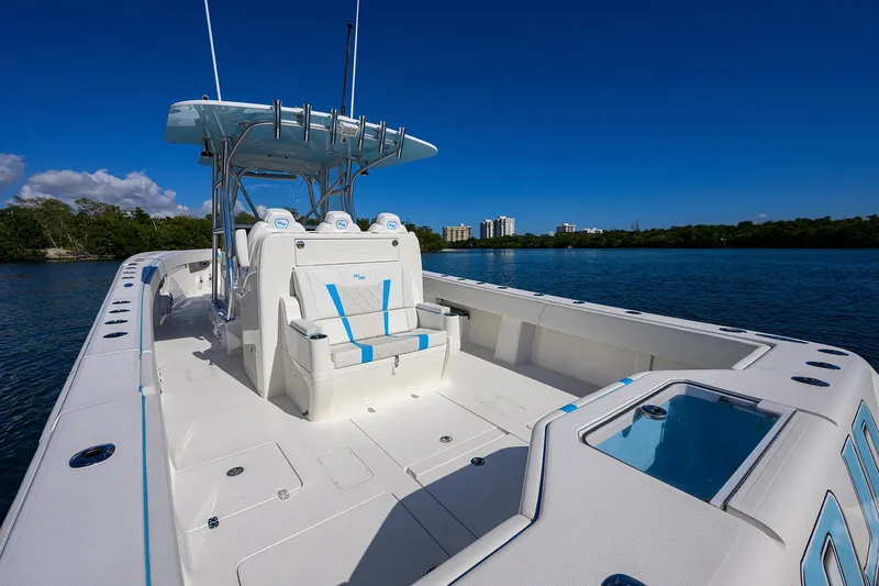  Yacht Photos Pics 2008 SeaVee 39b boat with spacious deck, blue accents, and clear sky backdrop.