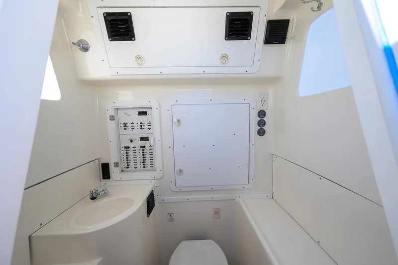 Yacht Photos Pics 2008 SeaVee 39b boat interior with control panel, sink, and toilet.