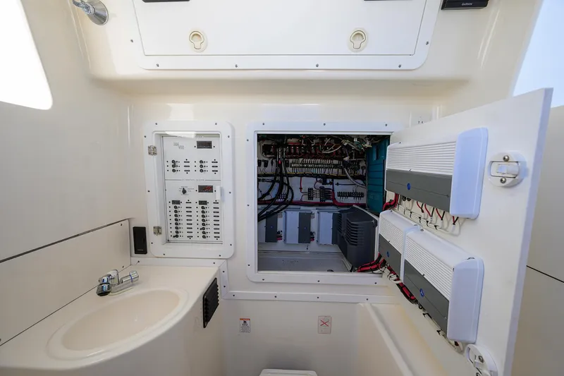  Yacht Photos Pics Electrical panel and sink inside 2008 SeaVee 39b boat cabin.